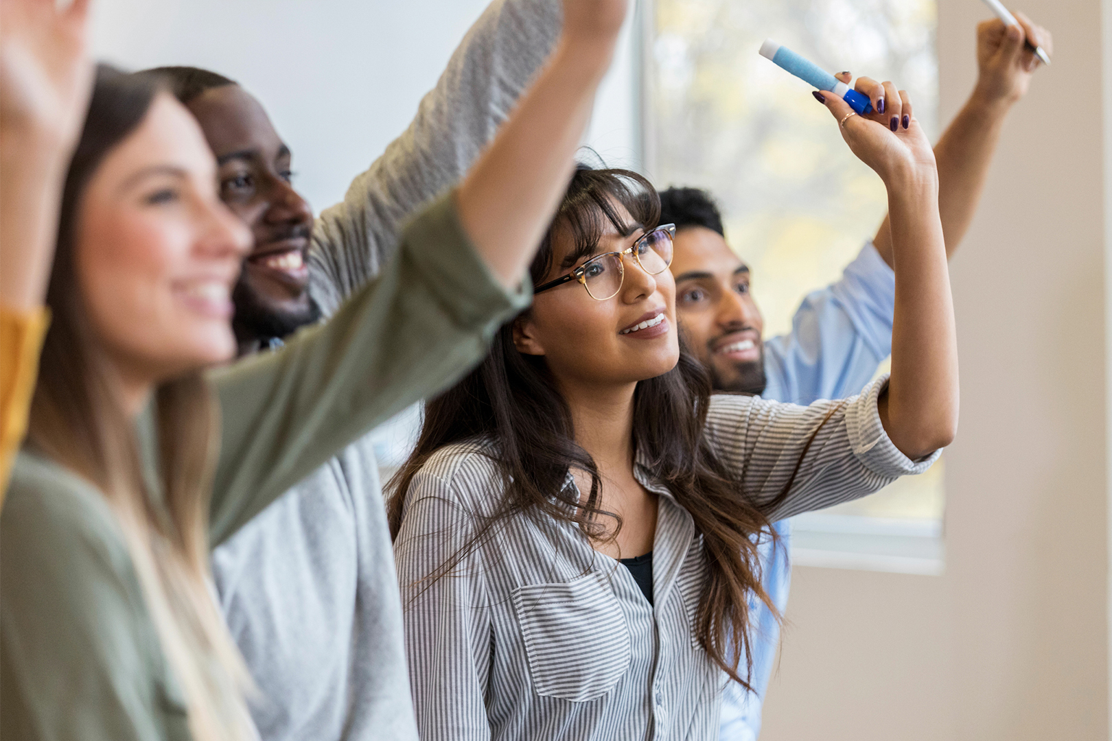 Volunteers raising their hands