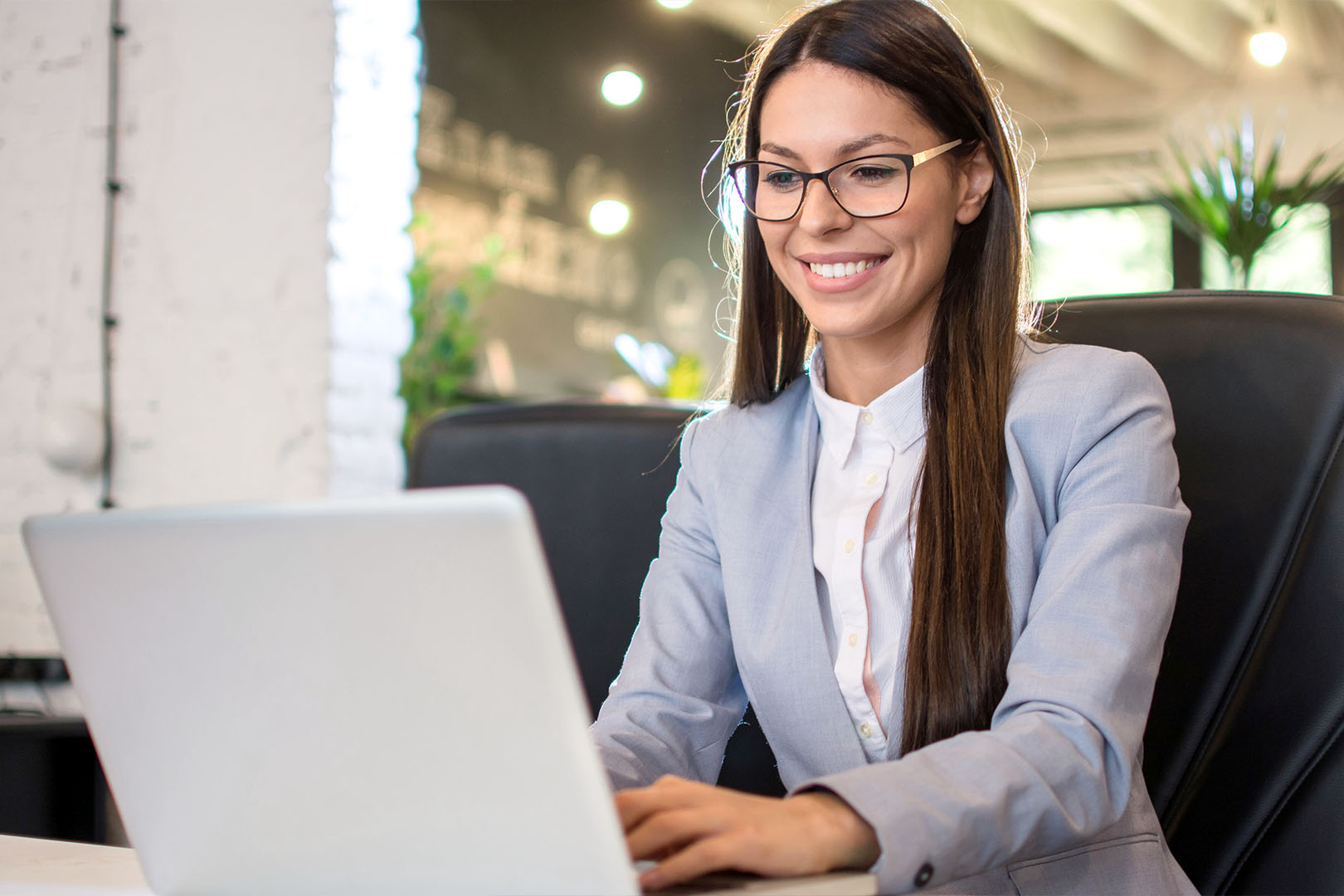 Woman typing on laptop