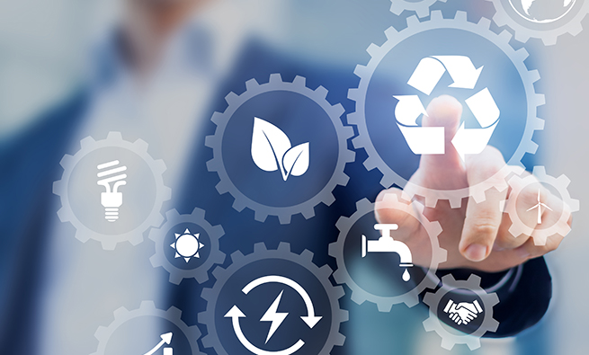Abstract photo of a man touching sustainability symbols in front of him
