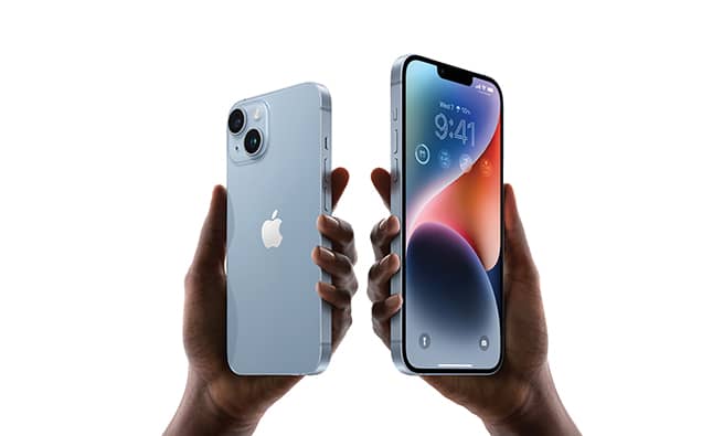 two hands holding iphones