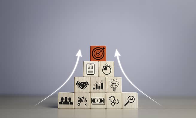 blocks positioned on a pyramid format with arrows pointing up