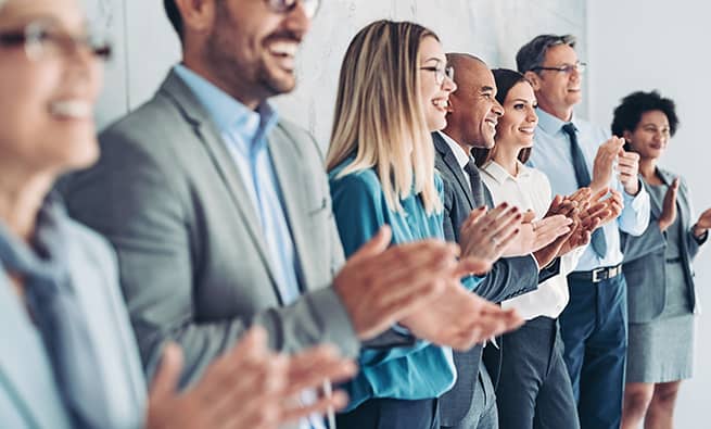 Group of diverse people clapping