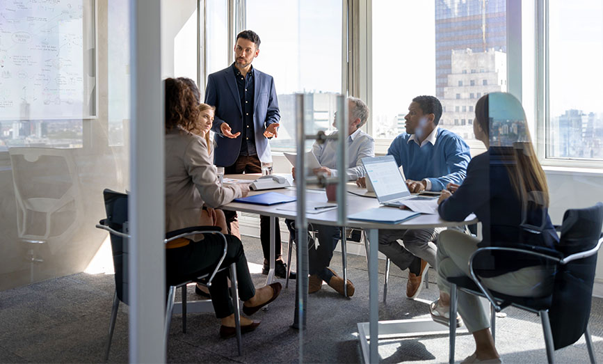 A group of people meeting in a conference room